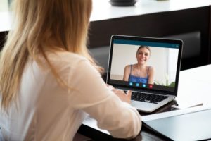 Two-young-women-chatting-online